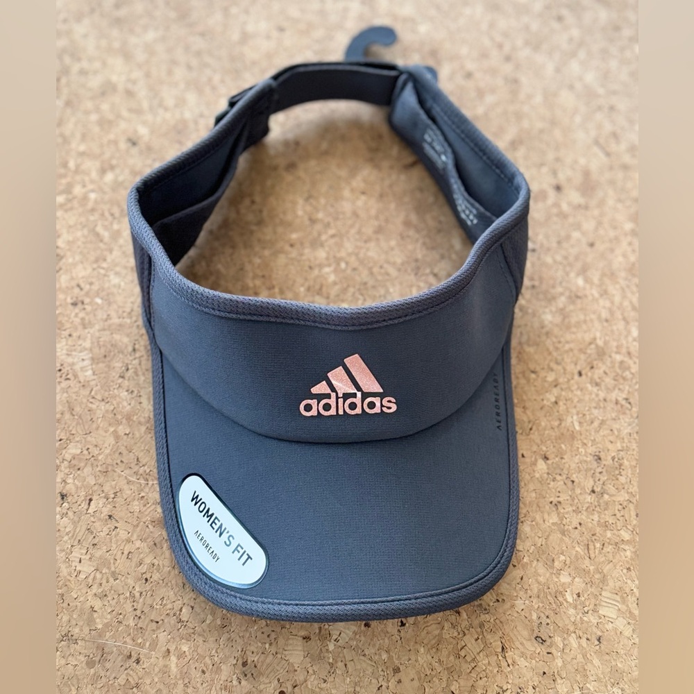 Adidas Gray Visor with Pink Logo. One size. Adjustable back strap. New w/ tags.